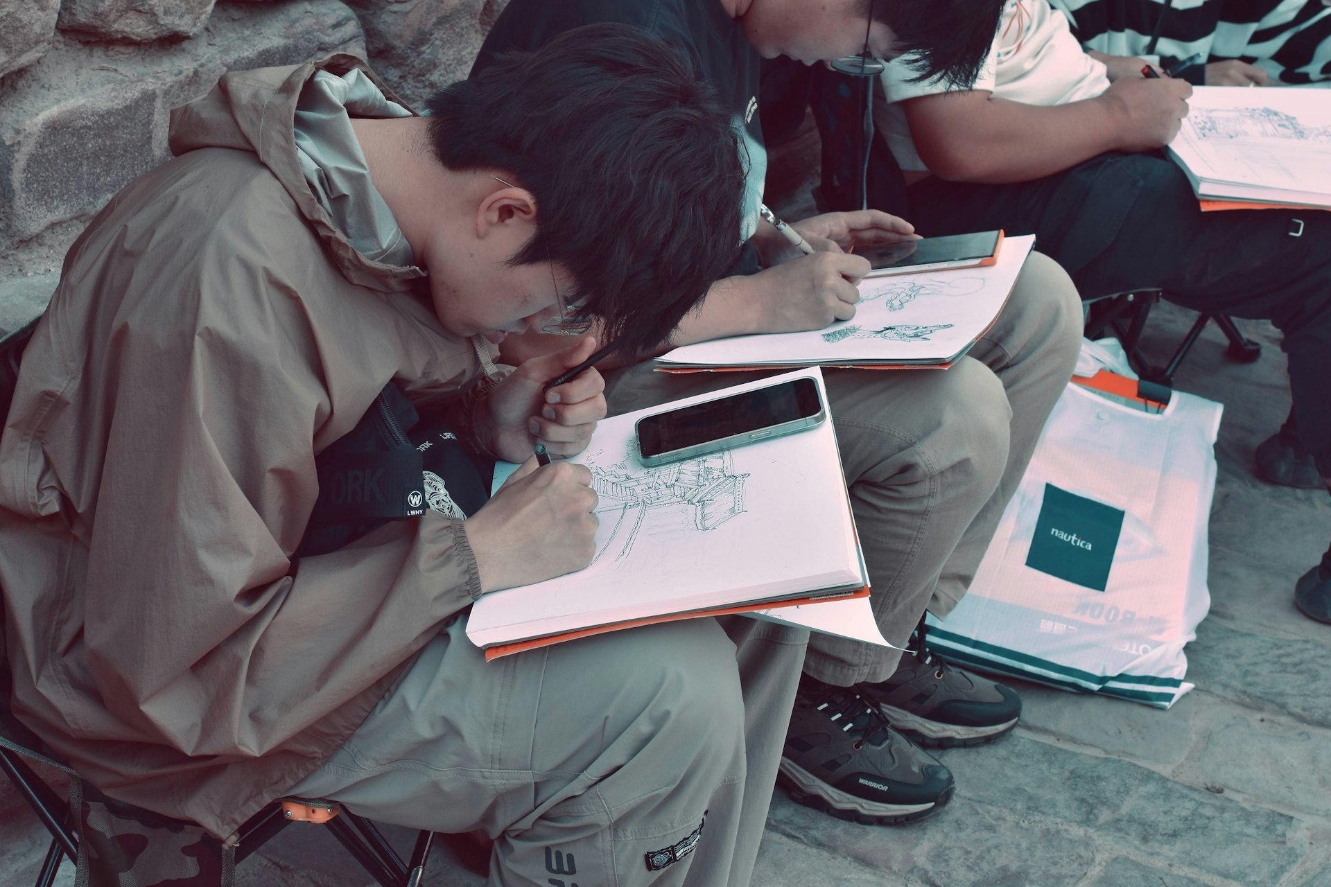 A group of people sitting next to each other